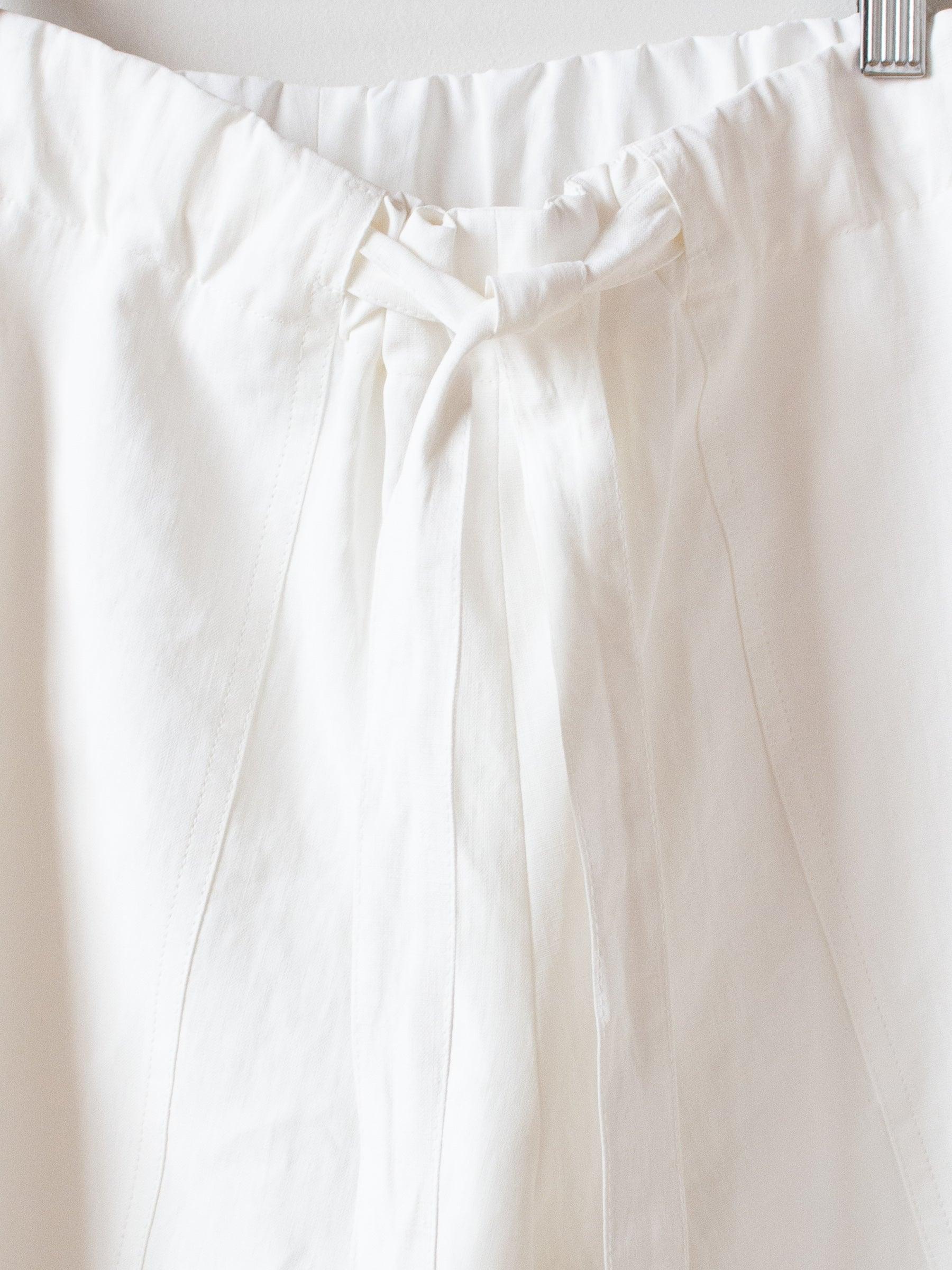 Namu Shop - Studio Nicholson Leda Coated Linen Shorts - Milk